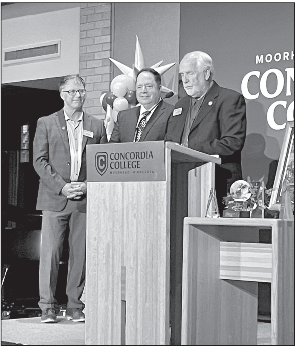 Award Ceremony, left to right, President Colin Irvine, Pete Smerud, and National Alumni Board Member Steve Buchholz. (Photo courtesy Pete Smerud)